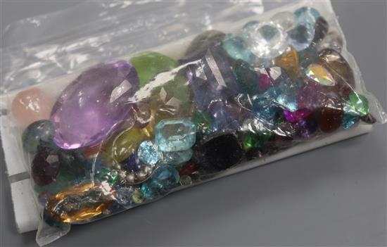 A quantity of assorted unmounted cut paste and gemstones, including amethyst, citrine, opal and garnet.